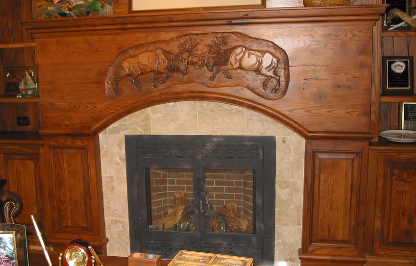 Hand carved fireplace mantle in office