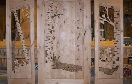 Hand carved wood birch scene on glass door