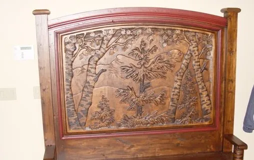 Hand carved nature landscape on bench